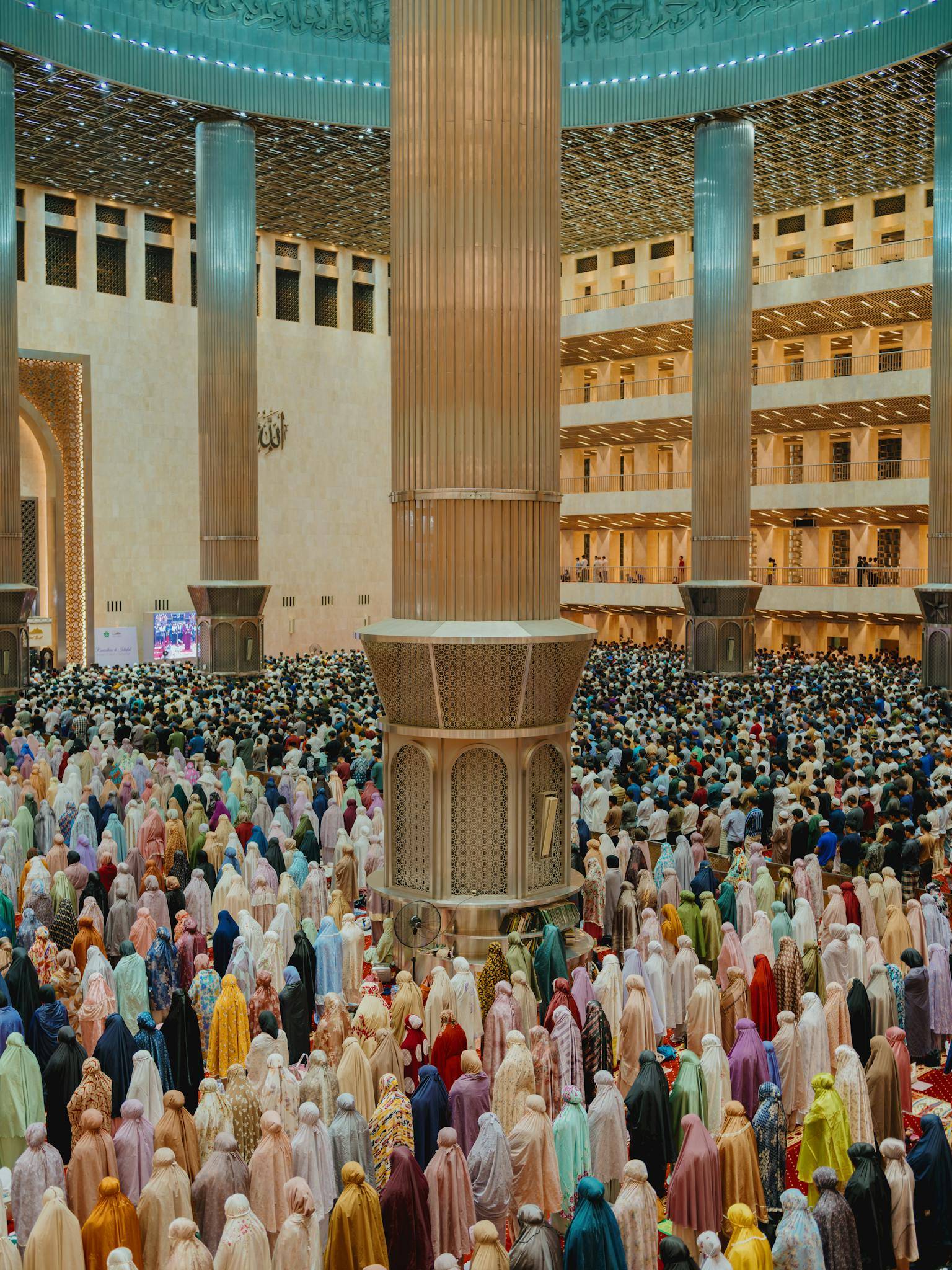 Worshippers gather inside Istiqlal Mosque, Jakarta, for prayer.